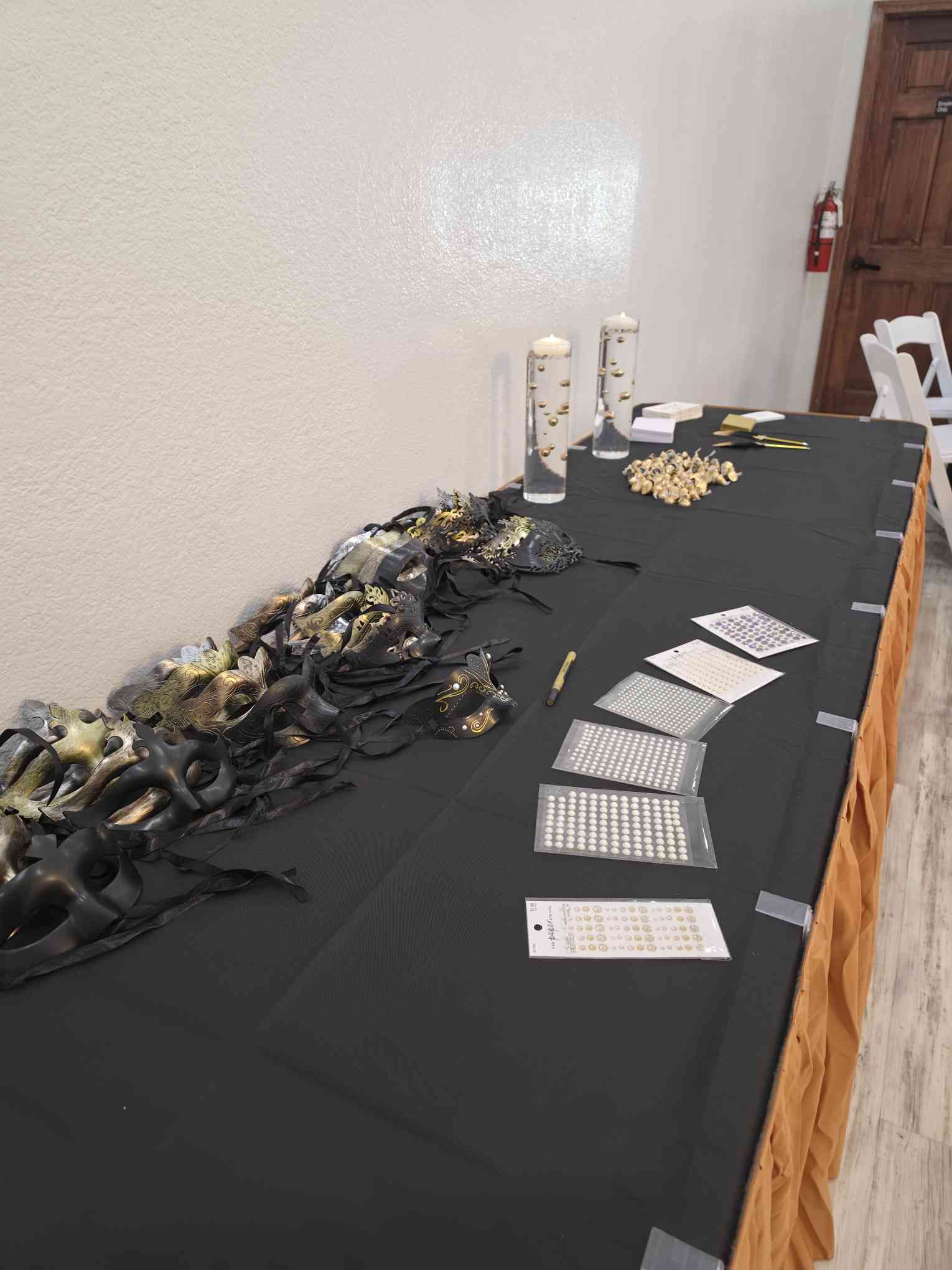 Favors and themed accessories table at Event Palace