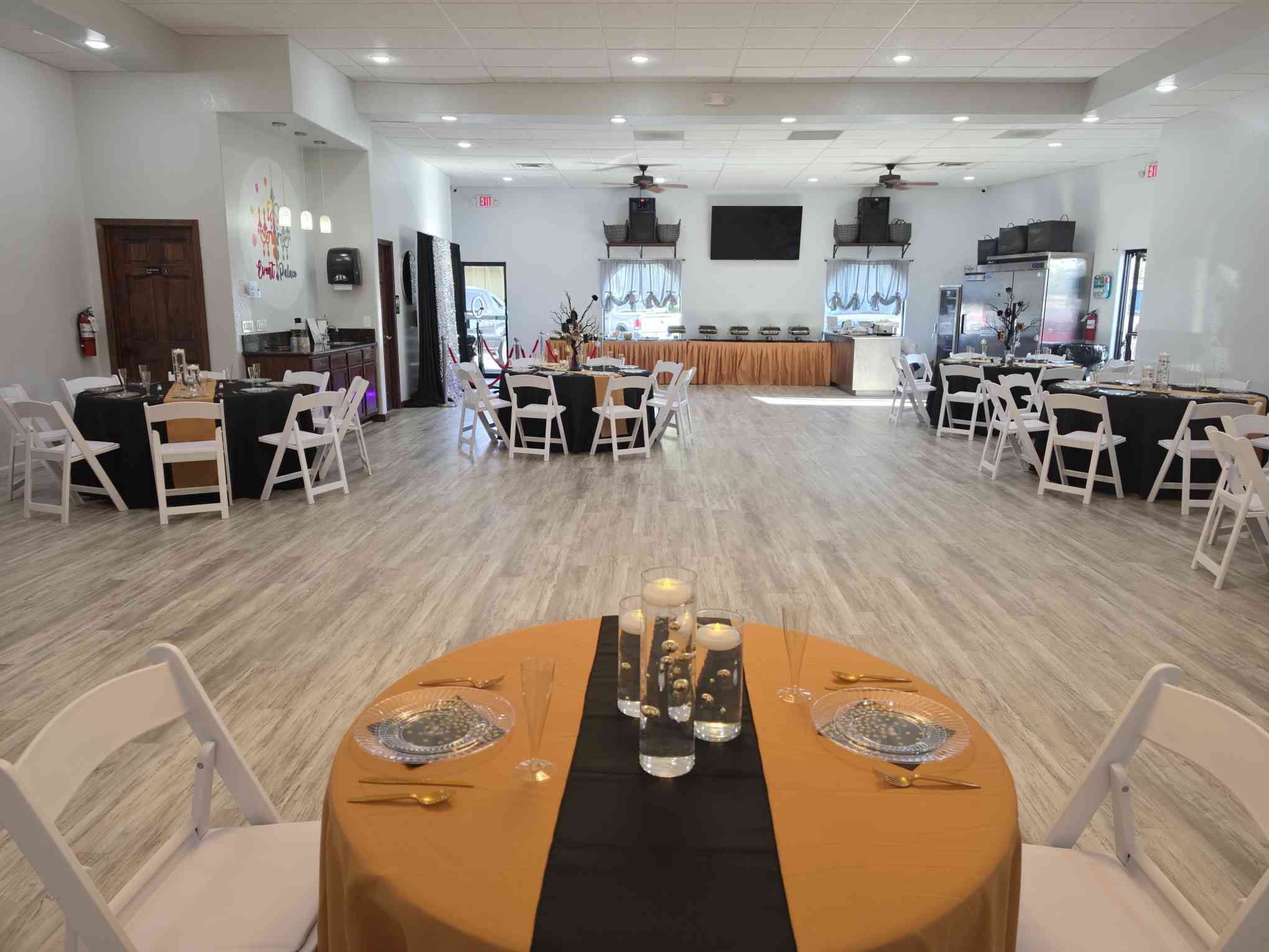 Wide room view with banquet tables at Event Palace